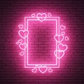 Neon heart frame on brick wall Royalty Free Stock Photo