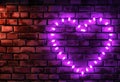 neon heart luminous sign against brick wall wall