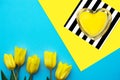 Neon heart and yellow tulips on a turquoise background, mock up, valentines day concept Royalty Free Stock Photo