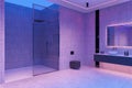 Neon hotel bathroom interior with glass shower, double sink and toilet