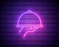 Neon icon of dish. Hand holding serving tray on brick wall background. Restaurant service concept. Can be used for neon signs, Royalty Free Stock Photo