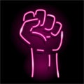 Neon icon of raised fist isolated on black background. Sign of human hand up. Protest, strength, victory, power Royalty Free Stock Photo