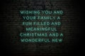 Neon inscription of christmas and new year greetings on brick wall Royalty Free Stock Photo