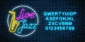Neon jazz cafe with live music and saxophone glowing sign with alphabet. Glowing street signboard Royalty Free Stock Photo