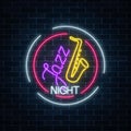 Neon jazz cafe with saxophone glowing sign in circle frame. Glowing invitation to jazz night in music bar. Royalty Free Stock Photo