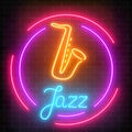 Neon jazz cafe with saxophone glowing sign with round frame on a dark brick wall background. Royalty Free Stock Photo