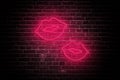 Neon Kiss: Valentine\'s Day Lips on Dark Brick Wall Royalty Free Stock Photo