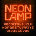 Neon Lamp alphabet font. Brick wall background. Stock vector typeface for your typography d