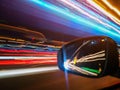 Neon lanes and car& x27;s reflection in rear view mirror Royalty Free Stock Photo