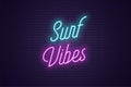 Neon lettering of Surf Vibes. Glowing text