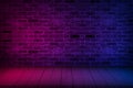 Neon light on brick wall texture background.