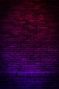 Neon light on brick walls that are not plastered background and texture. Lighting effect red and blue neon background vertical of Royalty Free Stock Photo