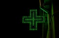 Neon light bulbs of pharmacy cross sign. Royalty Free Stock Photo