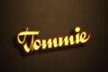 Yellow Neon Light Text Effect of name Tommie on Golden background Royalty Free Stock Photo