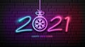 2021 Neon Light number happy new year, and snowflake colorful design on block wall black background Royalty Free Stock Photo