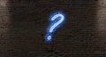 neon light question marks on a dark brick wall Royalty Free Stock Photo