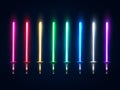 Neon light swords set. Glowing sabers collection isolated on dark background. Luminous weapon elements for game design. Royalty Free Stock Photo