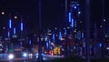 Neon lights on lights of night city. Stock footage. Night track of modern city is equipped with beautiful neon lights