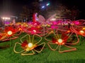 Neon lights in Tamar park glow colorfully at night in the shape of flowers and butterflies