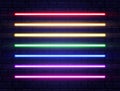 Neon lines collection on brick wall. Realistic led neon tube set. Rainbow borders. Bright design elements for Royalty Free Stock Photo