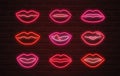 Neon lips signs over brickwall