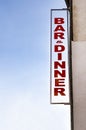 Neon lit BAR DINNER sign Royalty Free Stock Photo