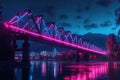 A neon lit bridge crossing a river at night Royalty Free Stock Photo