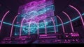 Futuristic control room with glowing neon lights and complex data displays on monitors Royalty Free Stock Photo