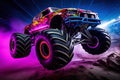 Neon-Lit Monster Truck in Action in Mid-Air Royalty Free Stock Photo