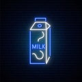 Neon milk sign. Grocery store glowing icon on a brick wall background.