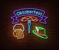 Neon Oktoberfest signs isolated on brick wall. Germany holiday light symbol, festival decoration effect. Neon oktoberfest