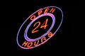 Neon 'Open 24 hours' sign Royalty Free Stock Photo