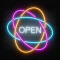 Neon open 24 hours in circle frames like planetary model sign on a dark brick wall background. Royalty Free Stock Photo