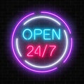 Neon open 24 hours 7 days a week sign in circle shaps on a brick wall background.