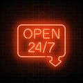 Neon open 24 hours 7 days a week sign in geometric shape with arrow on a brick wall background. Royalty Free Stock Photo