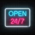 Neon open 24 hours 7 days a week sign in geometric shape on a brick wall background. Royalty Free Stock Photo