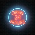 Neon open 24 hours sign on a brick wall background. Round the clock working bar or night club signboard with lettering.