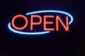Neon Open sign against black background. Royalty Free Stock Photo