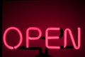 Lively Nights: Neon \'Open\' Sign Illuminating the Bar