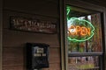 Neon Open Sign in Window of Rural Bait and Tackle Shop