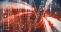 Neon orange light trails over computer code, program coding and technology concept Royalty Free Stock Photo