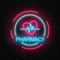 Neon pharmacy glowing signboard with heart shape and pulse graph in circle frames on brick wall background.