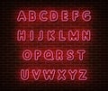 Neon pink alphabet type font vector isolated on brick wall. ABC typography letters light symbol, decoration text effect. Neon Royalty Free Stock Photo