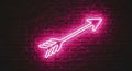 Neon pink arrow sign on brick Royalty Free Stock Photo