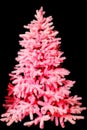 Neon pink colors Christmas tree isolated on black background