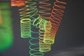 Neon plastic spring toy hang on to ceiling for photo backdrop and vintage concept Royalty Free Stock Photo