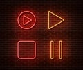 Neon player button signs vector isolated on brick wall. Play, stop, pause button light symbol, decor