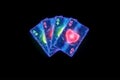 Neon playing cards for poker, four aces on a dark background. Design template. Casino concept, gambling, header for the site. Copy