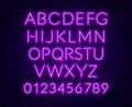 Neon purple alphabet on brick wall background. Capital letter.