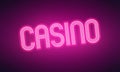 Neon purple pink glowing Casino word sign lit up at night Royalty Free Stock Photo